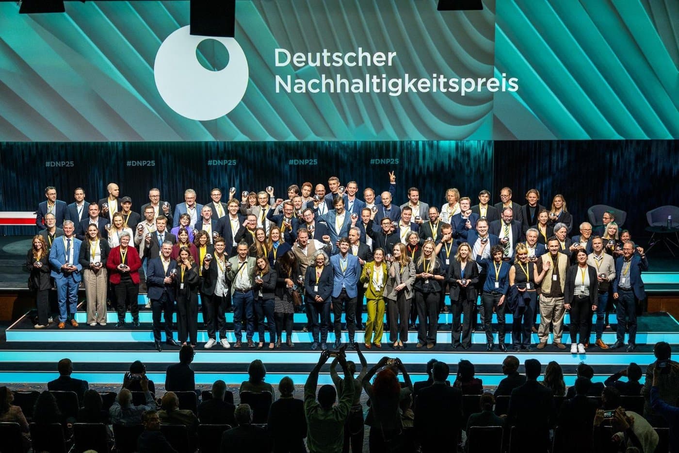 Full DNP25 winners group on stage